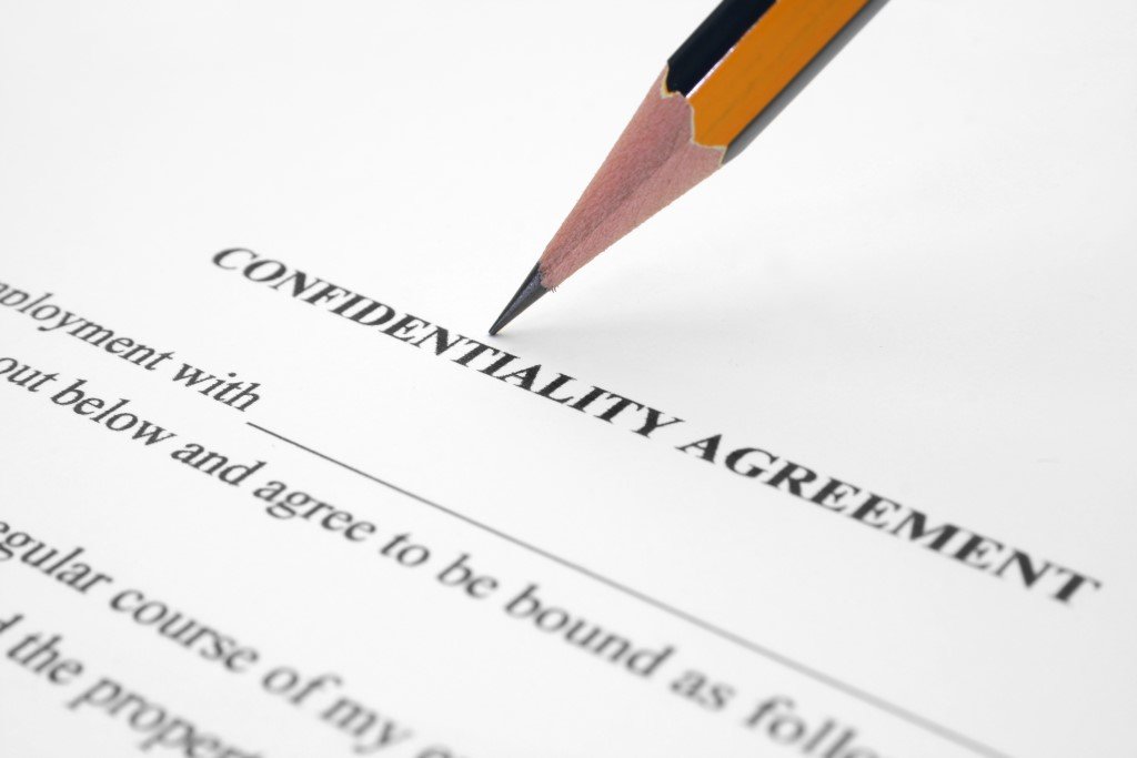 a Pencil Rests on a Document Titled "confidentiality Agreement," with the Text Partially Visible, Underscoring the Importance of Maintaining Integrity.