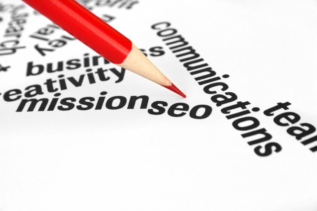 a Red Pencil Pointing to the Word "mission" Surrounded by Related Terms Such As "team," "seo," "communication," and "creativity" on a White Background, Emphasizing the Importance of Effective Communication in Achieving Goals.
