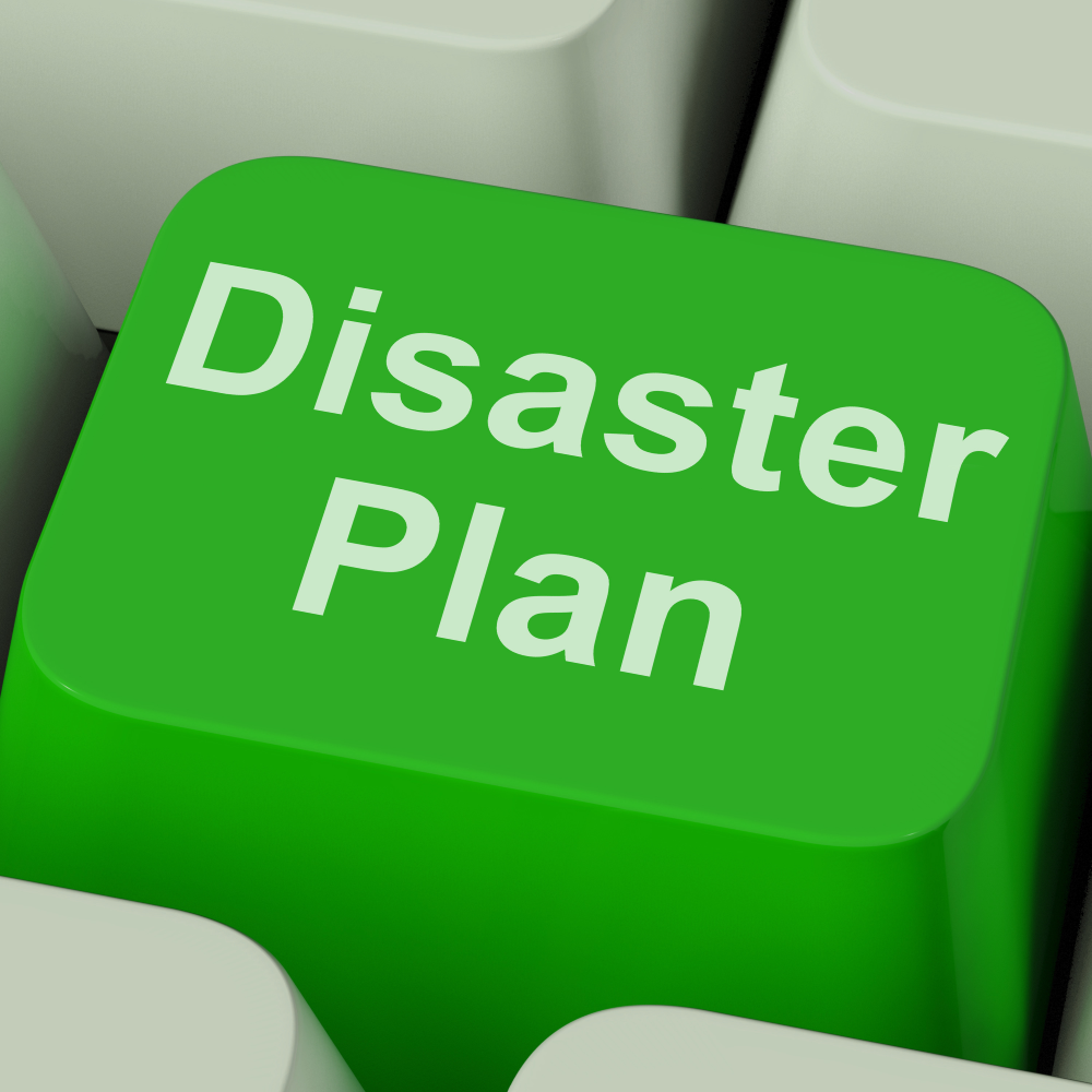 a Green Keyboard Button Labeled "disaster Plan" is Centered in the Image, Emphasizing the Importance of Disaster Recovery and Having an Emergency Strategy.