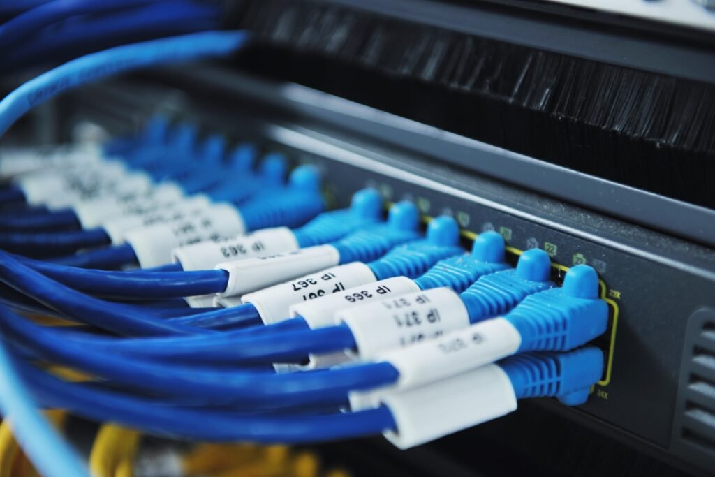 a Close Up of Blue and White Wires Connected to a Server in the Brand New Era of Networks with Edge Computing.