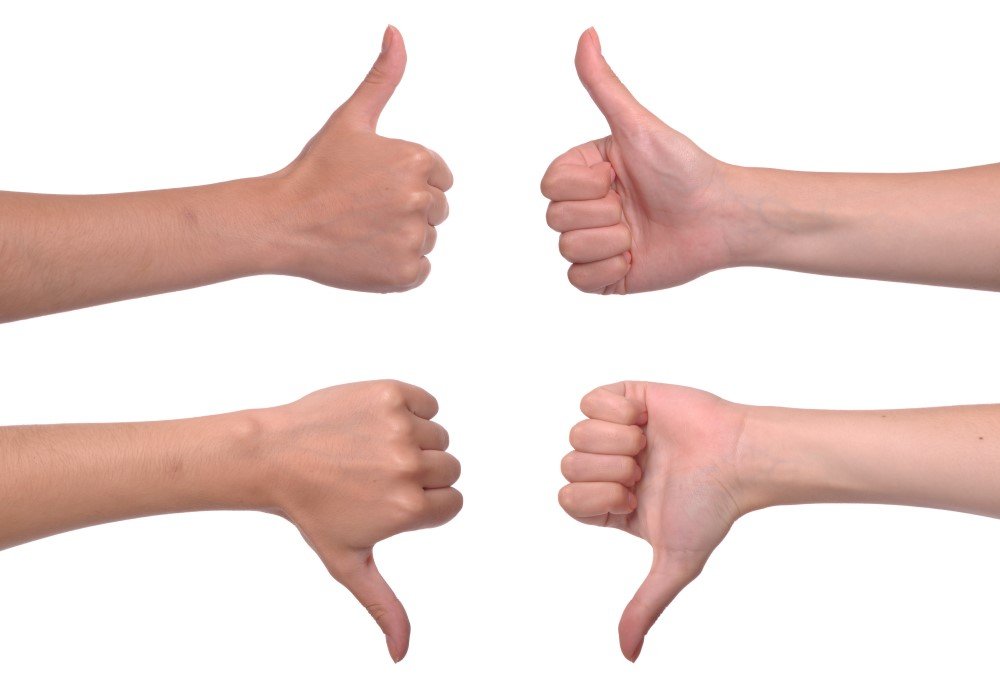 Thumbs Up and Thumbs Down Sign Isolated on White Background, Showcasing True Grit.