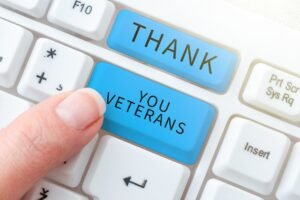 a Finger Presses a Blue Keyboard Key Labeled "thank You Veterans," Symbolizing Our Gratitude and Veteran Support in This New Era of Appreciation.