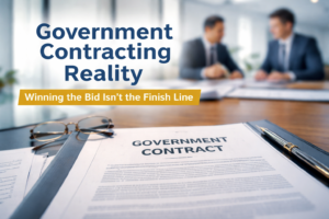 Close-up of a Government Contract Document on a Desk, with Two People in Suits Talking in the Background and Text About Government Contracting and Effective Contract Management.